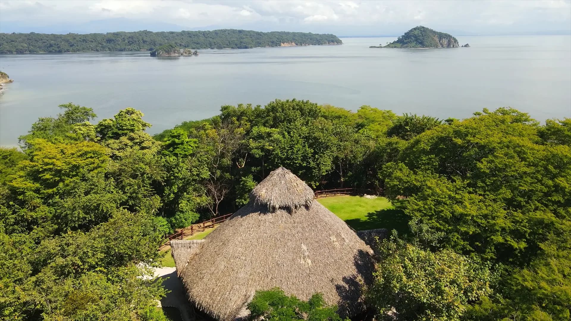 Aerial view of Soltara retreat nestled in lush forest by the sea